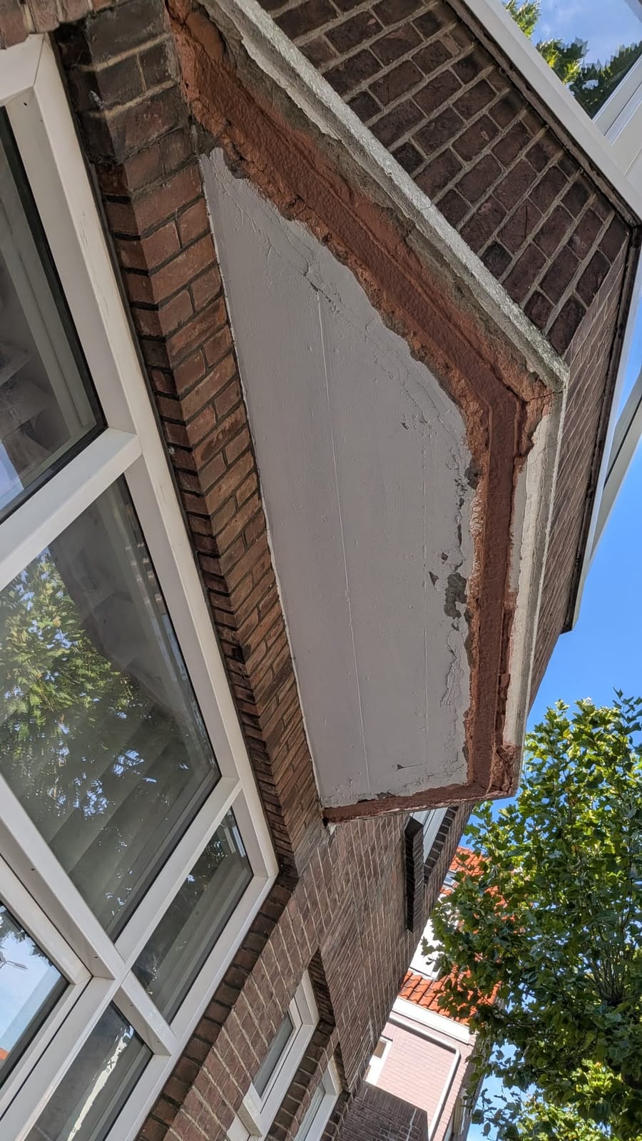 Betonherstel aan een erker