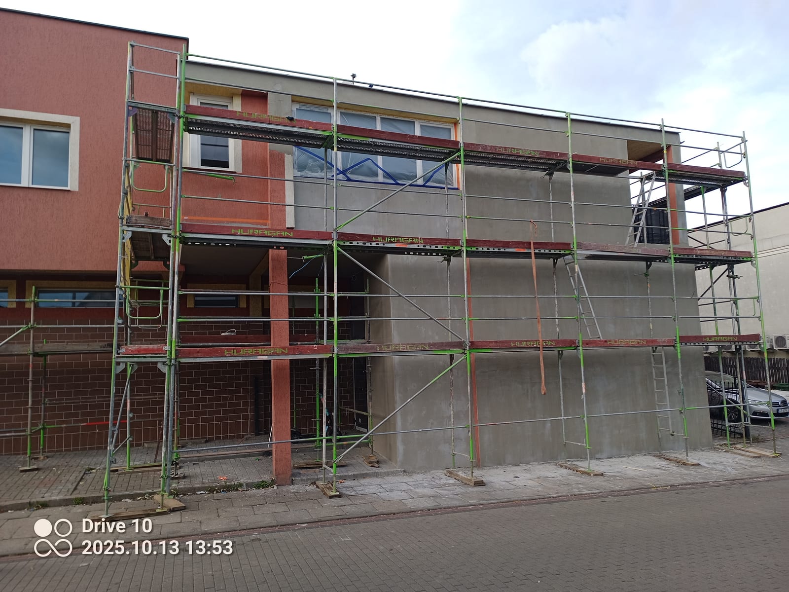 Gevelisolatie en sierpleister bedrijfspand, Voor